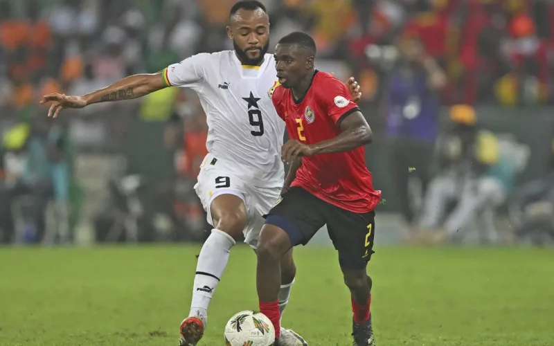 Mozambique's Infren Matola challenges Ghana's Jordan Ayew during the 2023 AFCON game in Abidjan. PHOTO/CAFOnline