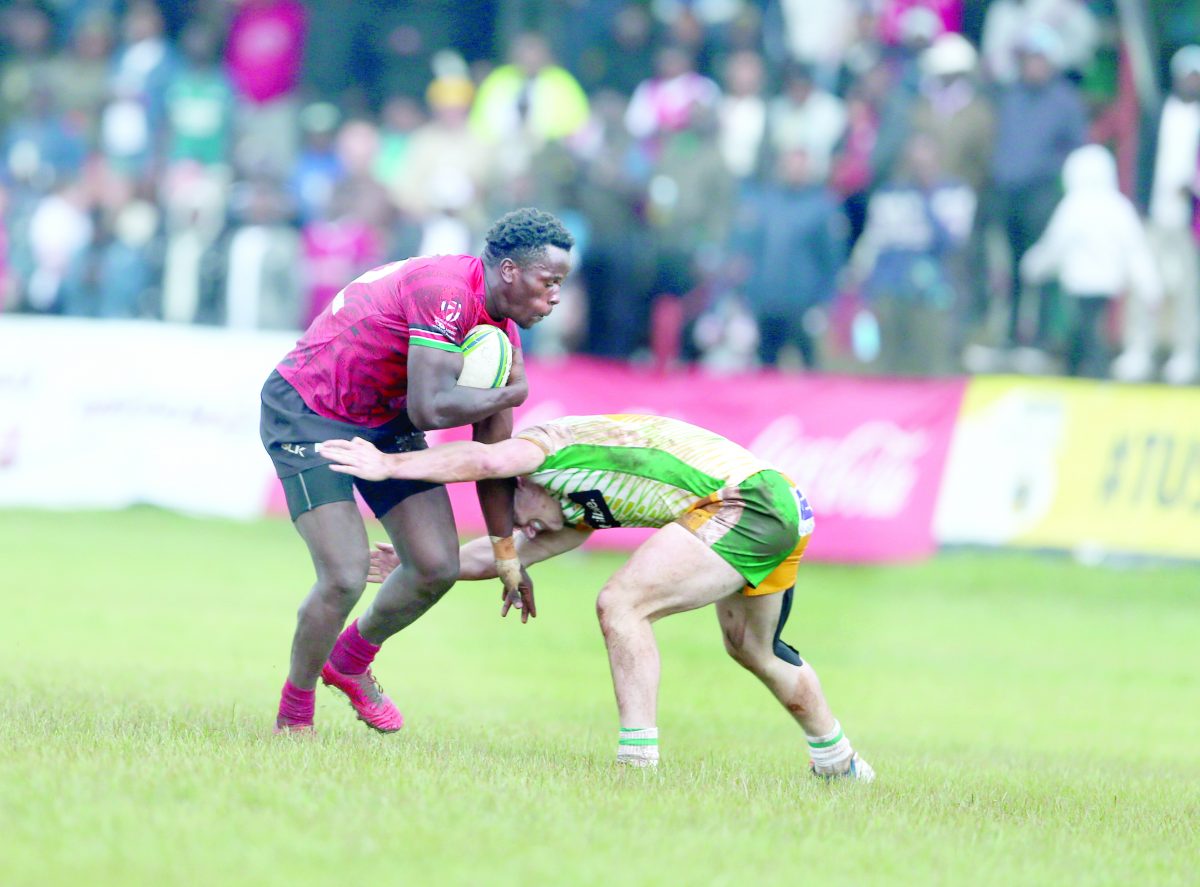 Friday, January 12, 2024 - Issue No. 07974 John Okoth (left) wards off a tackle attempt by a Samurai player during Safari 7s Cup final at the RFUEA ground in November last year. PHOTO/Alex Njue