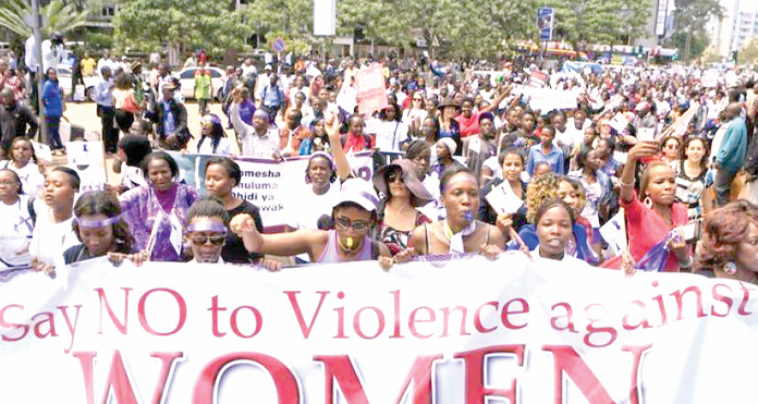 Protestors march along the streets of Nairobi to highlight the increased cases of violence against women . PHOTO/Kenna Claude