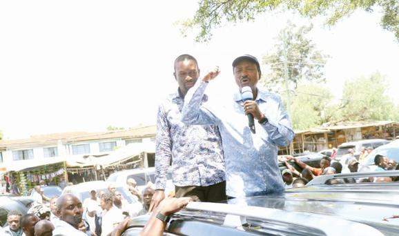 Wiper Party leader Kalonzo Musyoka (right) and ODM secretary general Edwin Sifuna at Kenyatta Market in Nairobi after attending a church service yesterday. PHOTO/ Kenna Claude