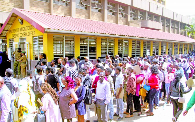 Passport seekers queue for service at Nyayo House to collect their Passports in Nairobi. 