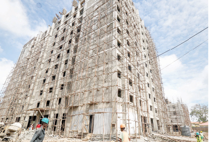 Workers at the construction site of the Ruiru Affordable Housing project, Kiambu. PHOTO/Print