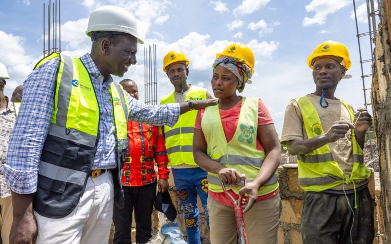 President William Ruto with workers at the Bomet Affordable Housing Project.