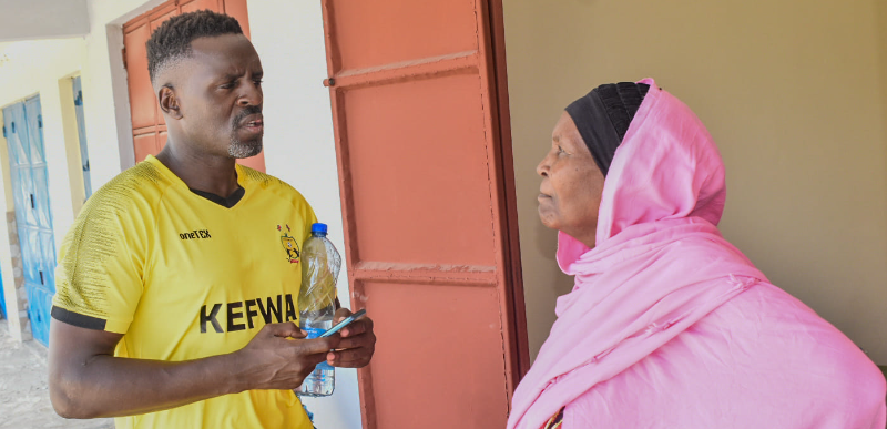 kEFWA President James Situma with Abdalla Juma's mother. PHOTO/KEFWA