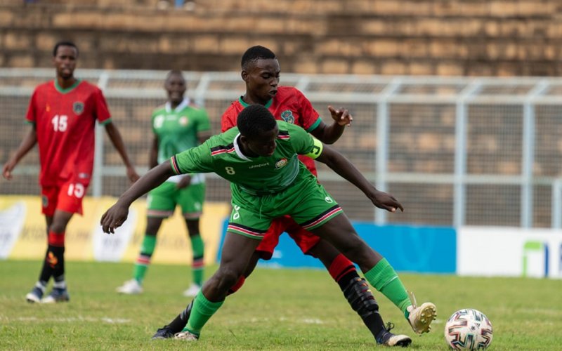 Rising Stars captain shield the ball against Malawi. PHOTO/Malawi FA