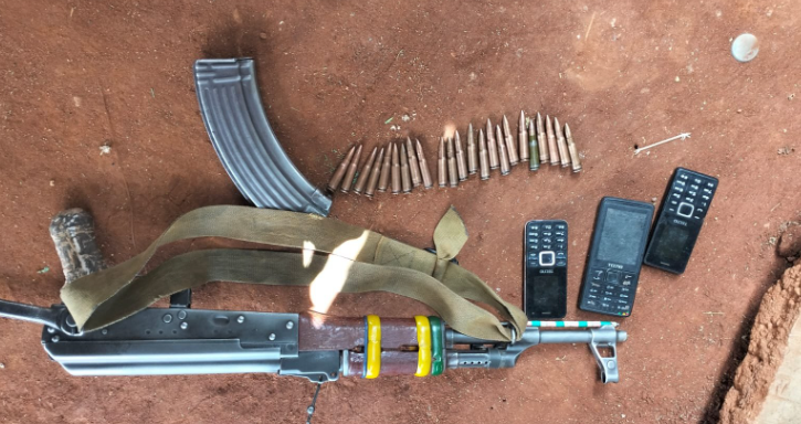 Gun and phones recovered by Police. PHOTO/National Police