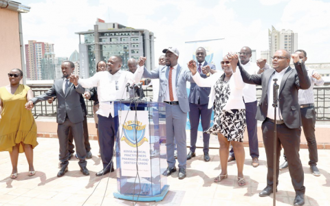 KMPDU Secretary General Davji Atellah (3rd right) leads other union leaders in a solidarity song after addressing the media in Nairobi, yesterday.
