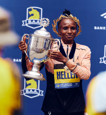 Kenya's long-distance runner Hellen Obiri holds the trophy after winning the Boston Marathon. PHOTO/(@WilliamsRuto)/X