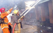 Firefighters at work. Research suggests the hero label on such workers is loaded with unhelpful assumptions about their personal needs and ambitions. PHOTO/Print