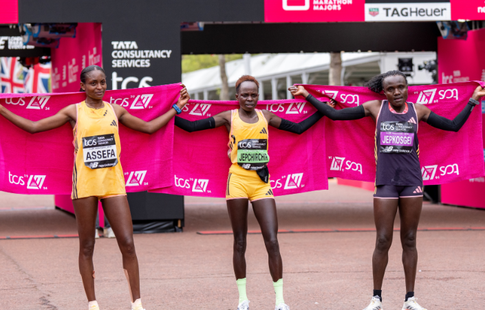 Peres Jepchirchir, Tigist Assefa, and Joyciline Jepkosgei on the London Marathon podium.