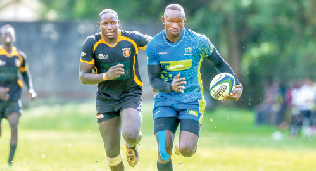 Levy Amunga of KCB RFC, rushes to score try as Bakari Ian, CUEA Rfc, tries to keep up during their Enterprise Cup opening match on April 20, 2024. PHOTO/KCB