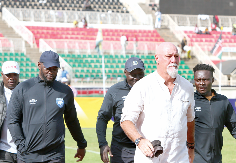 Former AFC Leopards head coach Patrick Aussems (in white) heads to the technical bench before a past Kenyan Premier League match. PHOTO/Print