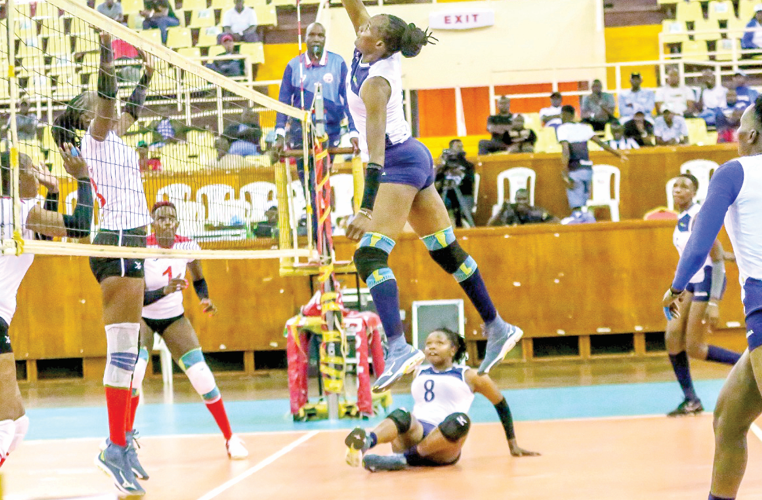 Edith Wisa of KCB strikes against Kenya Prison during a league match at the weekend. PHOTO/ KCB