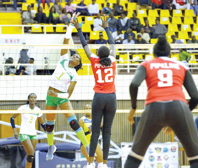 KCB’s Edith Wisa (centre) in action against Kenya Pipeline during the on going KVF League. PHOTO/KVF