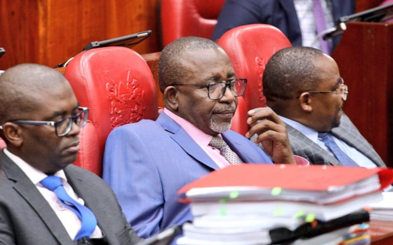 Agriculture CS Mithika Linturi (center) and his counsel during the committee hearing. PHOTO/X (@NAssemblyKE)