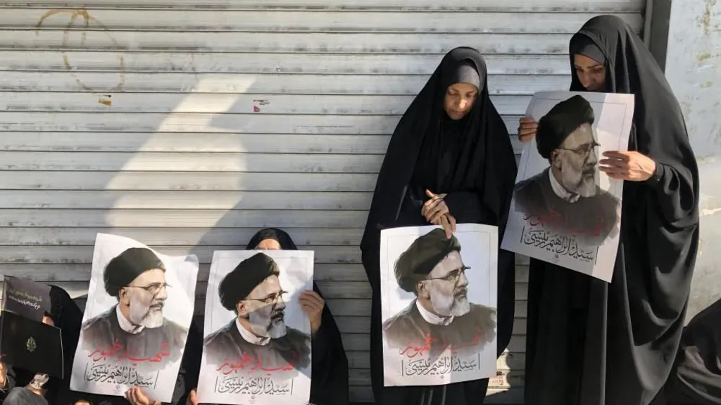Iran’s supreme leader leads prayers at Raisi funeral