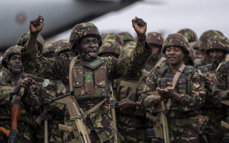 Kenya Defence Forces clap and sing as they prepare to deploy to Goma in eastern Congo as part of the East African Community Regional Force at a military airport in Nairobi, Kenya, on Wednesday, Nov. 16, 2022. | Ben Curtis/AP Photo