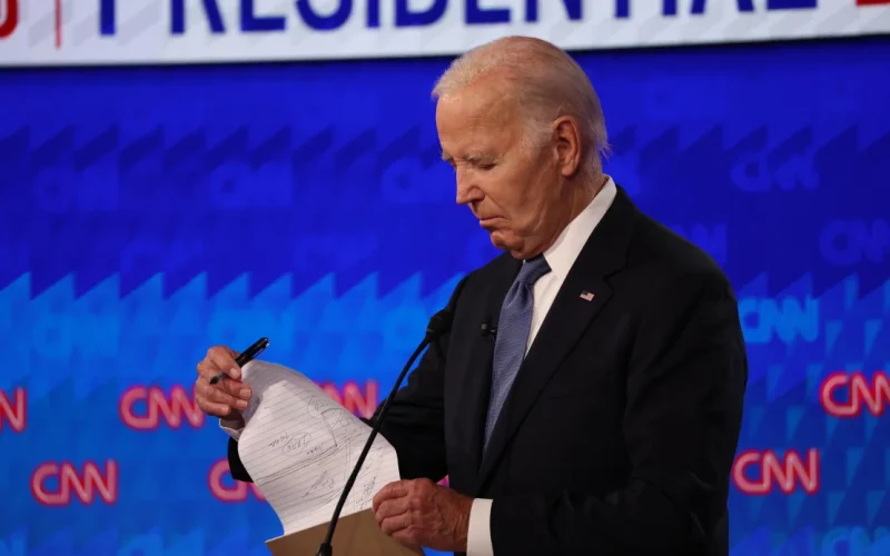 President Joe Biden flips through his notes during the debate in Atlanta. PHOTO/CNN