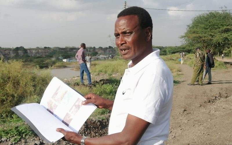 Sholinke Mca Stephen Kisemei showing the community correspondence with Nema and ministry of environment over dangerous illegal mining in the area. PHOTO /Christine Musa