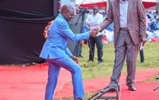 Deputy President Rigathi Gachagua helps President William Ruto onto the platform during a church service in Nyahururu on June 23, 2024. PHOTO/@rigathi/X