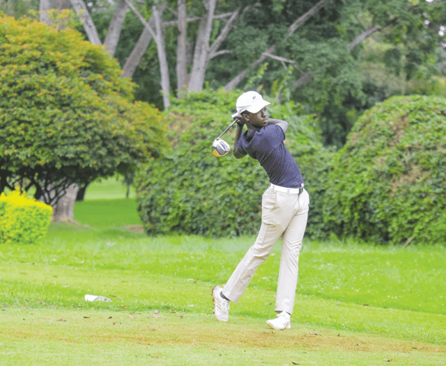 Junior golfer Alvin Kaisha taking a swing at the NCBA Golf Series at Muthaiga Golf Club. PHOTO/Print