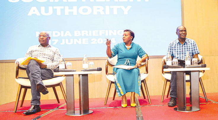 Health Cabinet Secretary Susan Nakhumicha explains how the new medical scheme under the Social Health Authority will work for Kenyans during a SHA Media Immersion engagement with journalists in Nairobi on Monday evening. She was franked by Medical Services PS Harry Kimtai and acting DG Health, Dr Patrick Amoth (right). PHOTO/PHILLIP KAMAKYA