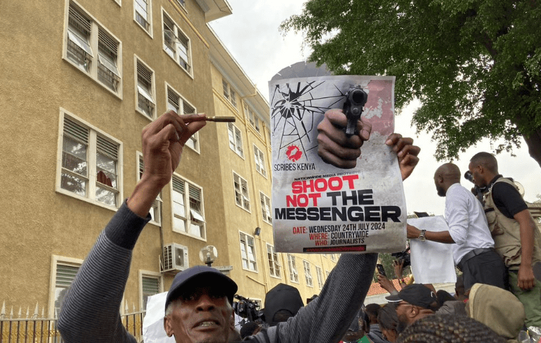 Journalists with a cartridge and  placard during the demos. PHOTO/@K24TV/X