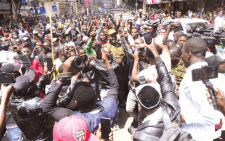 Protestors swarm Nairobi Regional Police Boss, Adamson Bungei who they accused of using excess police force while handling them. PHOTO/kenna claude