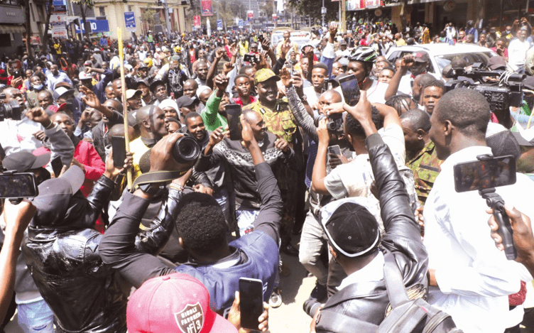 Protestors swarm Nairobi Regional Police Boss, Adamson Bungei who they accused of using excess police force while handling them. PHOTO/kenna claude