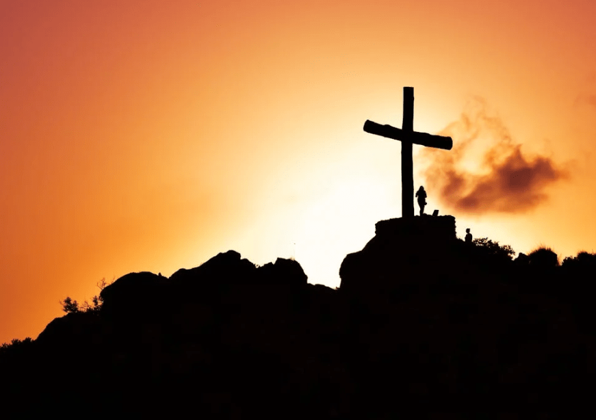 A person standing beside a crucifix. Image used for representation purposes. PHOTO/Pexels