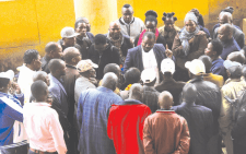 Family members of the victims of Garissa University terror attack talk to lawyer John Mwariri from Kituo Cha Sheria, one of the lawyers representing them. PHOTO/Charles Mathai