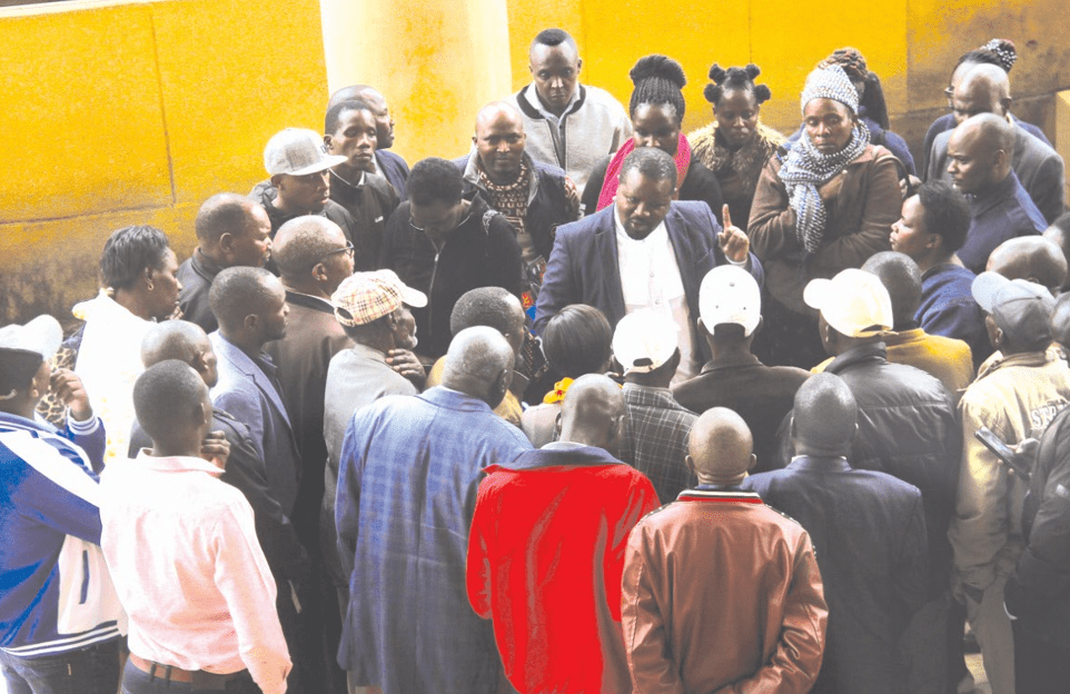 Family members of the victims of Garissa University terror attack talk to lawyer John Mwariri from Kituo Cha Sheria, one of the lawyers representing them. PHOTO/Charles Mathai