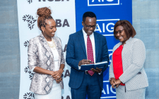 Louisa Wandabwa, Chief of Staff and Director of Strategy NCBA Group(left), John Gachora, Group Managing Director NCBA Group and Stella Njung’e MD AIG Kenya