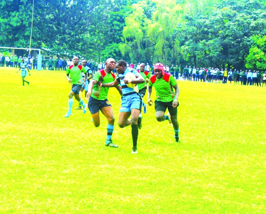 Koyonzo Boys rugby team player (C) shrugs off opponent Vihiga Boys player. COURTESY/KOYOZO BOYS