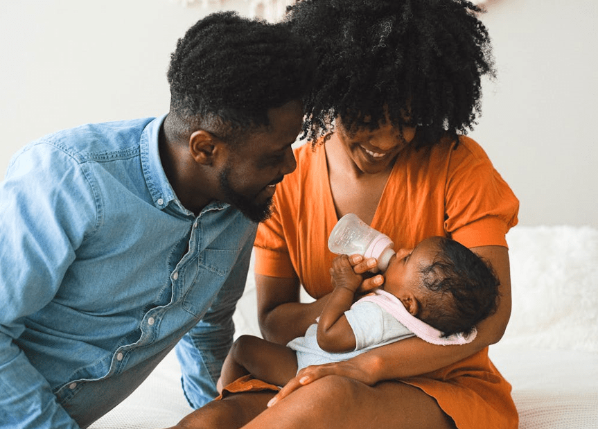 Parents feeding feeding their child with a bottle. Image used for representation purposes. PHOTO/Pexels