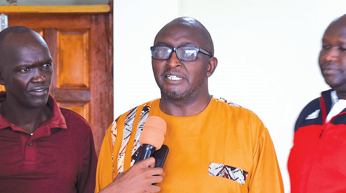 Rift Valley Secondary Schools Sports Association Vice chairman Sammy Githungu addressing jounalists at Bomet University after the meeting with the referee and coaches. PHOTO/EMMANUEL RONO