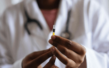 A person holding an injection. PHOTO/Pexels