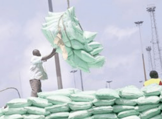 Workers receive a consignment of sugar imported at the Mombasa port. PHOTO/Print