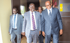 Raila Odinga and Environment Cabinet Secretary Aden Duale after addressing participants during a High-Level Forum of Africa Green Climate Finances National Designated Authorities Network (AfDAN)at a Nairobi Hotel. PHOTO/Philip Kamakya