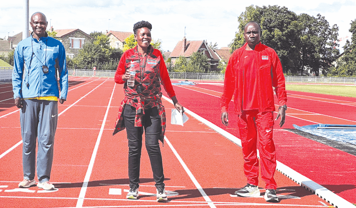 Coach Ruth Chumo (centre) shares a light moment with fellow coaches Henry Kirwa and Abraham Tarbei during the team’s final training session in Compiegne on Wednesday. PHOTO/James Waindi