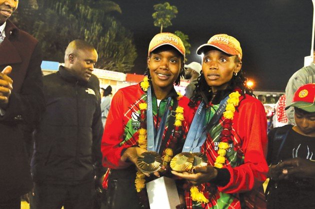 Double Olympic medalists Faith Kipyegon and Beatrice Chebet at the Jomo Kenyatta International Airport (JKIA) after landing from Paris on Tuesday night. PHOTO/RODGERS NDEGWA