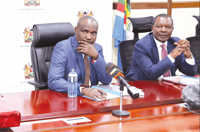 Treasury Cabinet Secretary John Mbadi (left) with his predecessor Prof. Njuguna Ndung’u at the Treasury Building offices in Nairobi. PHOTO/Kenna Claude