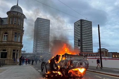 A car set on fire during protests in Sunderland, UK on Friday, August 2, 2024. PHOTO/@yourDactor/X