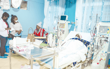 Medics attend to a patient at Kenyatta Hospital. PHOTO/ Philip Kamakya