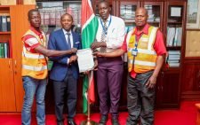 The Clerk of the National Assembly Samuel Njoroge receiving digital boda boda riders' petition. PHOTO/https://www.facebook.com/ParliamentKE