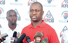 Kenya Film Classification Board acting manager in charge of licensing Marcus Alexander (centre) during a press briefing in Kisumu town on Wednesday. PHOTO/Noven Owiti