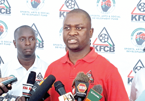 Kenya Film Classification Board acting manager in charge of licensing Marcus Alexander (centre) during a press briefing in Kisumu town on Wednesday. PHOTO/Noven Owiti