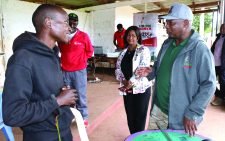 Gerald Gitonga Maina, is a Athletics Kenya (AK) president Jack Tuwei (R) talks to Gerald Gitonga Maina (L) during the registration process. PHOTO/David Macharia