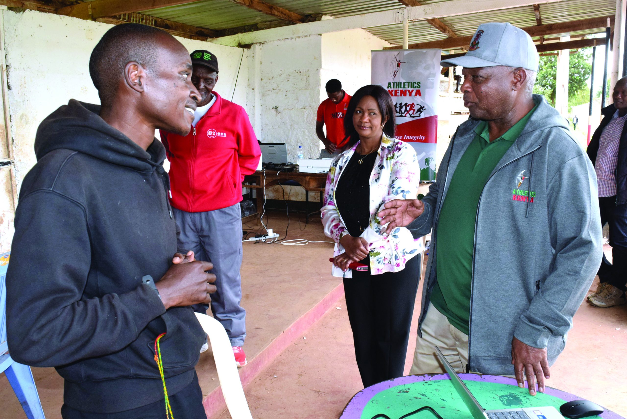 Gerald Gitonga Maina, is a Athletics Kenya (AK) president Jack Tuwei (R) talks to Gerald Gitonga Maina (L) during the registration process. PHOTO/David Macharia