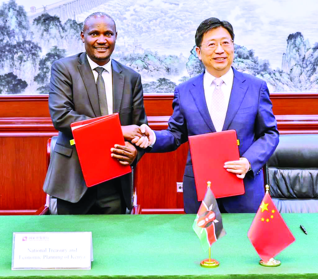 Treasury CS John Mbadi with the President of China Development Bank Tan Jiong after signing an MoU in Beijing China on September 6 to construct 15 rural roads across Kenya. PHOTO/Print